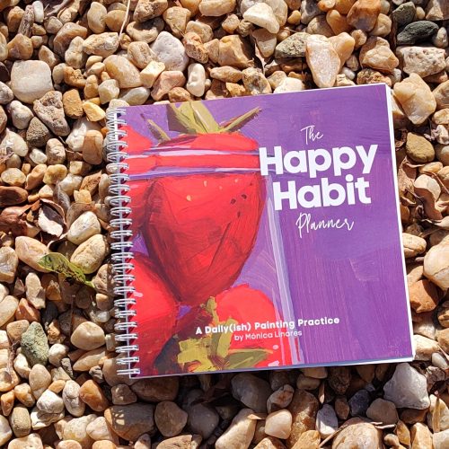 Happy Habit Planner on rocks